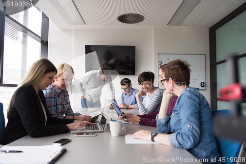 Image of Group of young people meeting in startup office