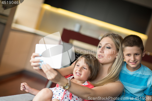 Image of Young Family Using A Tablet To Make Future Plans