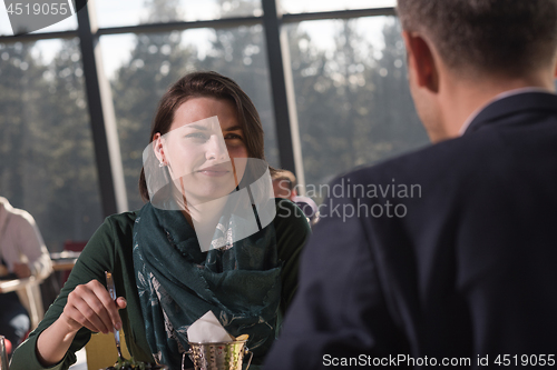 Image of Closeup shot of young woman and man having meal.