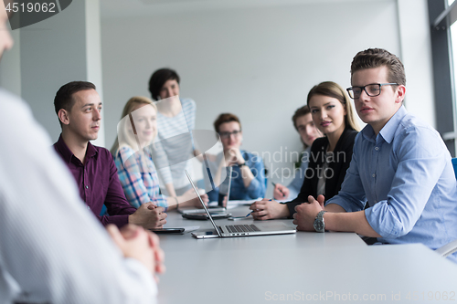 Image of Business Team At A Meeting at modern office building