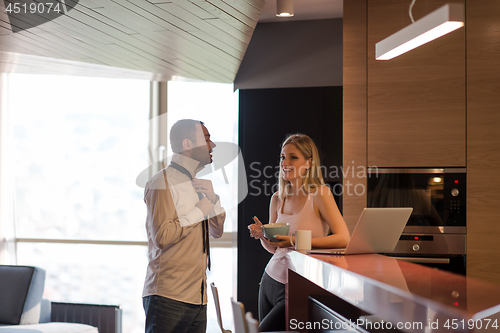 Image of A young couple is preparing for a job and using a laptop