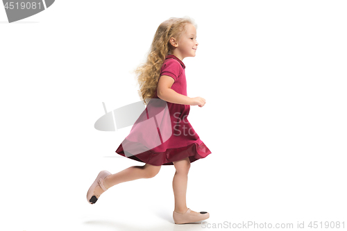 Image of Smiling cute toddler girl three years running over white background