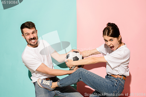 Image of The unhappy and angry fans on colored blue and pink background.