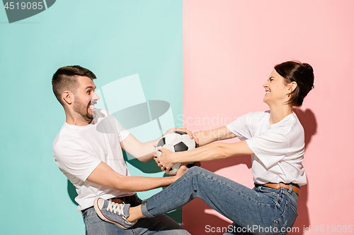 Image of The unhappy and angry fans on colored blue and pink background.