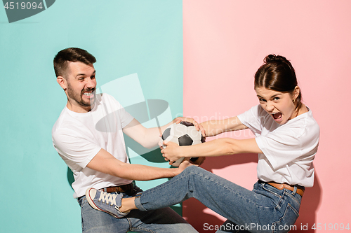 Image of The unhappy and angry fans on colored blue and pink background.