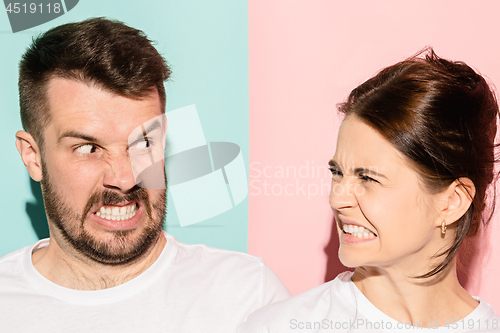 Image of attractive angry couple fighting and shouting at each other