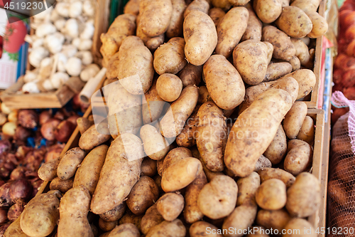 Image of A closeup of potatoes in wooden boxes