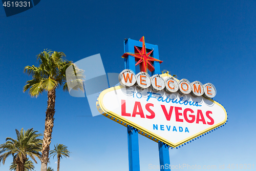 Image of welcome to fabulous las vegas sign and palm trees