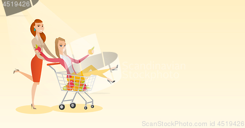 Image of Couple of friends riding in shopping trolley.