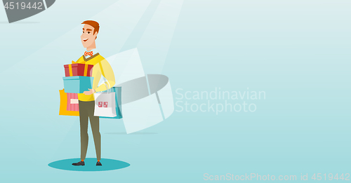 Image of Caucasian man holding shopping bags and gift boxes