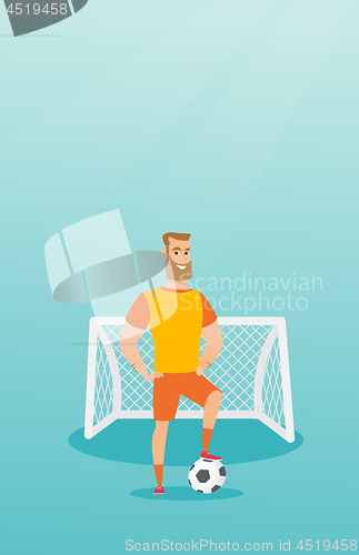 Image of Young caucasian football player with a ball.