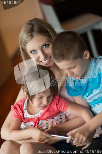 Image of Young Family Using A Tablet To Make Future Plans