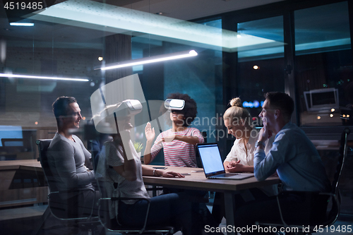 Image of Multiethnic Business team using virtual reality headset