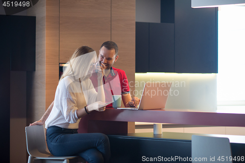 Image of happy young couple buying online