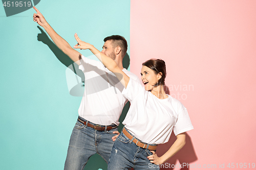 Image of A couple of young man and woman dancing hip-hop at studio.