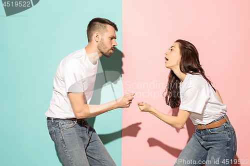 Image of A couple of young man and woman dancing hip-hop at studio.