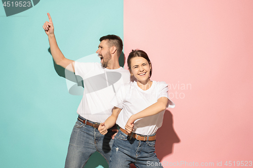 Image of A couple of young man and woman dancing hip-hop at studio.