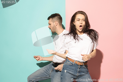 Image of A couple of young man and woman dancing hip-hop at studio.