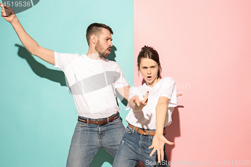 Image of A couple of young man and woman dancing hip-hop at studio.