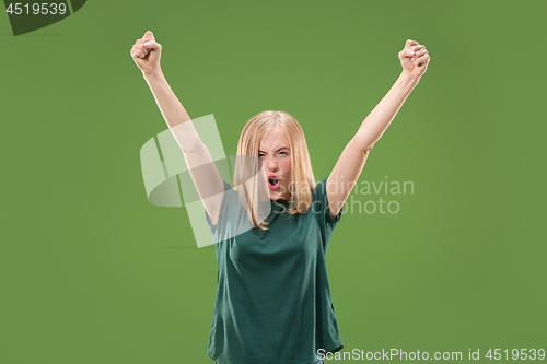 Image of Winning success woman happy ecstatic celebrating being a winner. Dynamic energetic image of female model