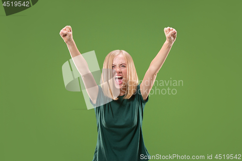 Image of Winning success woman happy ecstatic celebrating being a winner. Dynamic energetic image of female model