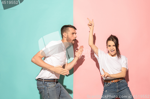 Image of A couple of young man and woman dancing hip-hop at studio.