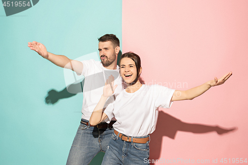 Image of A couple of young man and woman dancing hip-hop at studio.