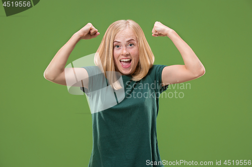 Image of Winning success woman happy ecstatic celebrating being a winner. Dynamic energetic image of female model