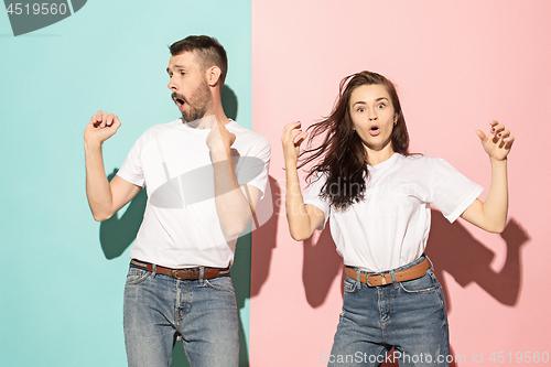 Image of A couple of young man and woman dancing hip-hop at studio.