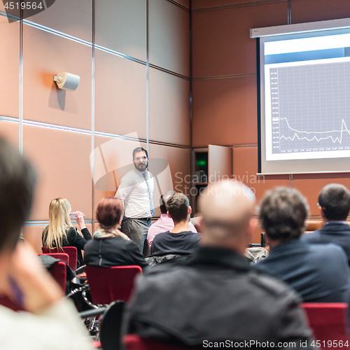 Image of Skiled Public Speaker Giving a Talk at Business Meeting.