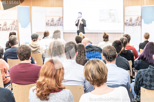 Image of Business speaker giving a talk at business conference event.