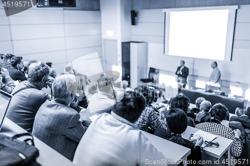 Image of Business speaker giving a talk at business conference event.