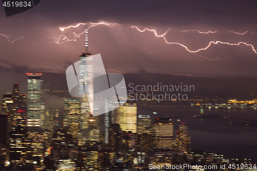 Image of Artistic motion blured image of New York City skyline with lower Manhattan skyscrapers in lightning storm