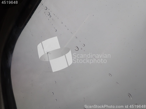 Image of Car window with rain streaks