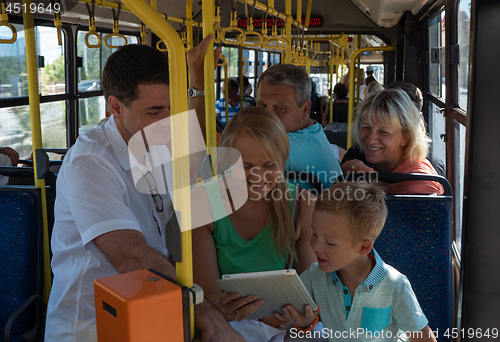 Image of A joyful family in a bus