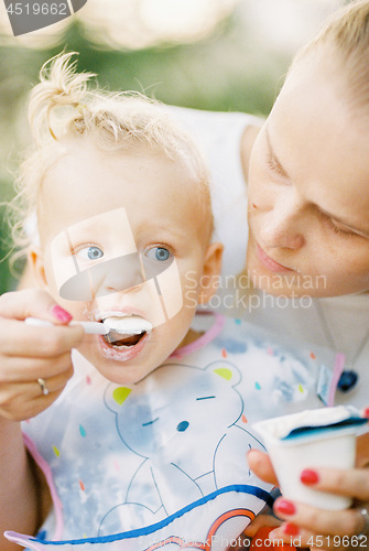 Image of Feeding a baby girl