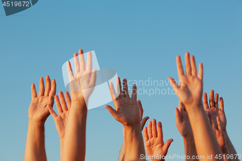 Image of Ten raised hands