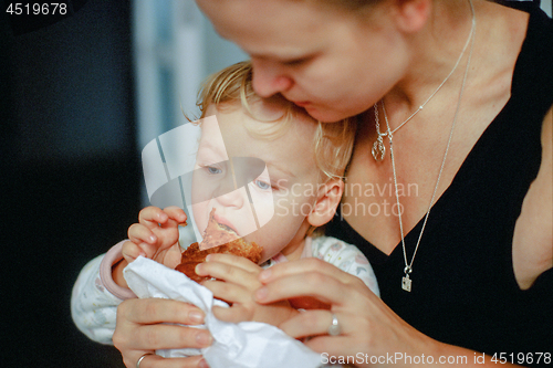 Image of Feeding a baby with pastry