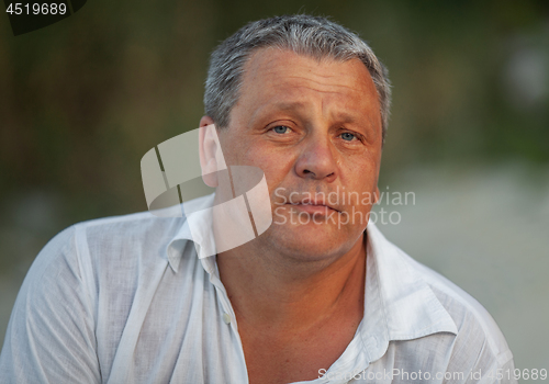 Image of Outdoor portrait of mature man