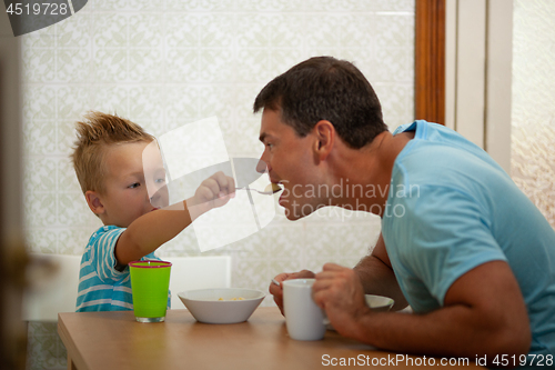 Image of Spoon-feeding of a father