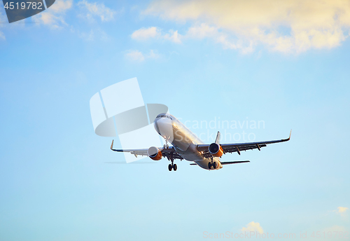 Image of Flying airplain over blue sky