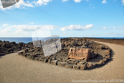 Image of Los Hervideros rusty sign 