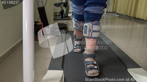 Image of Child with foot drop system walking on the treadmill