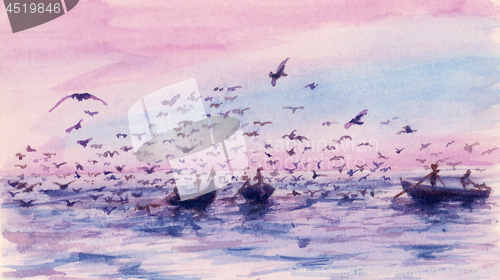 Image of Small fishing boats and birds under warm sky