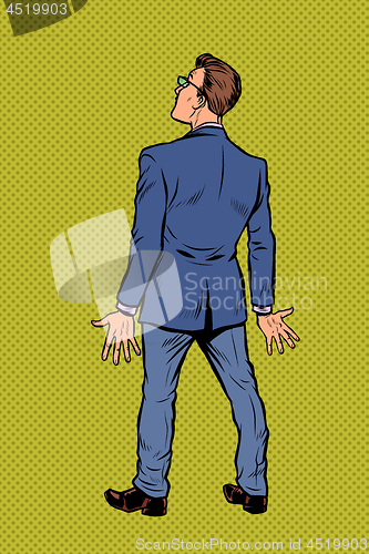 Image of businessman stands back