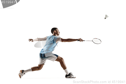 Image of Little boy playing badminton isolated on white studio background