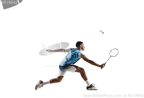 Image of Little boy playing badminton isolated on white studio background