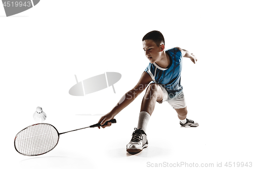 Image of Little boy playing badminton isolated on white studio background