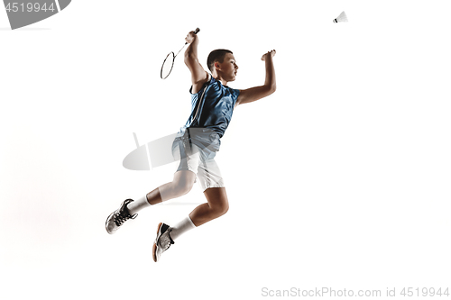 Image of Little boy playing badminton isolated on white studio background