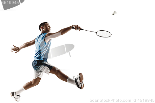 Image of Little boy playing badminton isolated on white studio background